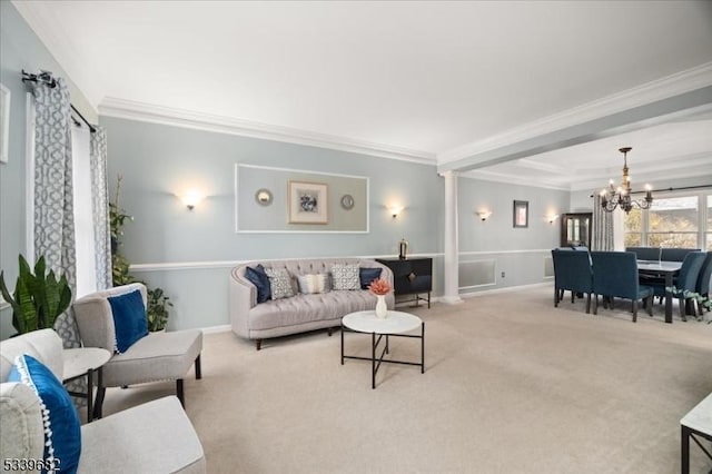 living room with carpet floors, baseboards, a chandelier, and crown molding