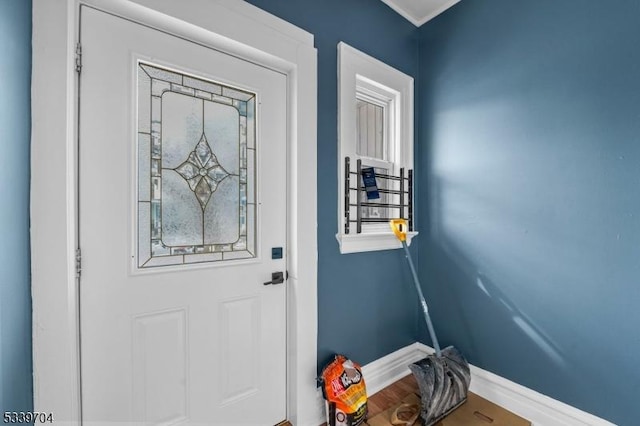 entryway featuring baseboards