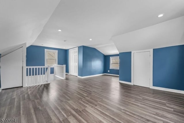 additional living space featuring recessed lighting, vaulted ceiling, baseboards, and wood finished floors