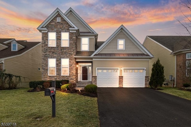 view of front of property with a garage, stone siding, aphalt driveway, and a front yard