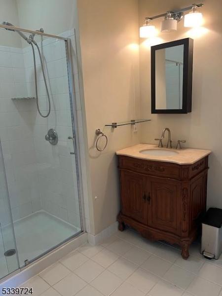 5107 Sanctuary Blvd Unit 5107, Riverdale Boro, NJ 07457 - bathroom featuring a shower stall, tile patterned flooring, and vanity