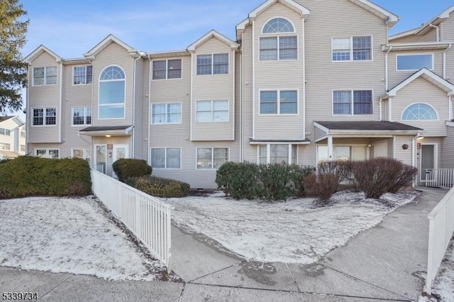 view of front of house featuring fence