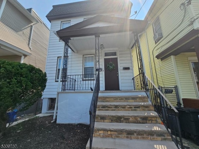 doorway to property with covered porch