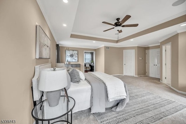 bedroom with carpet, baseboards, a tray ceiling, and recessed lighting