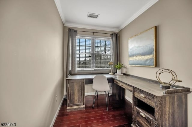 office space featuring crown molding, visible vents, dark wood-type flooring, built in study area, and baseboards