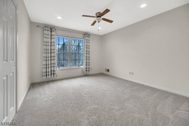 unfurnished room featuring carpet floors, recessed lighting, visible vents, a ceiling fan, and baseboards