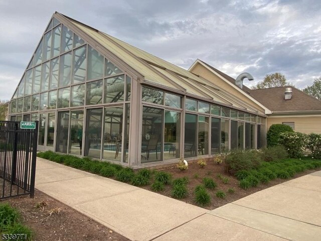 2104 Avery Ct Unit 2104, Franklin Twp, NJ 08873 - back of property featuring a sunroom