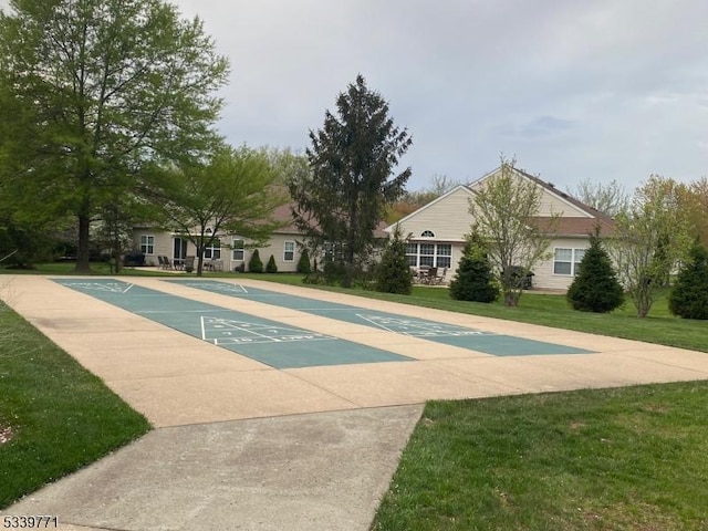 2104 Avery Ct Unit 2104, Franklin Twp, NJ 08873 - view of community featuring a lawn and shuffleboard