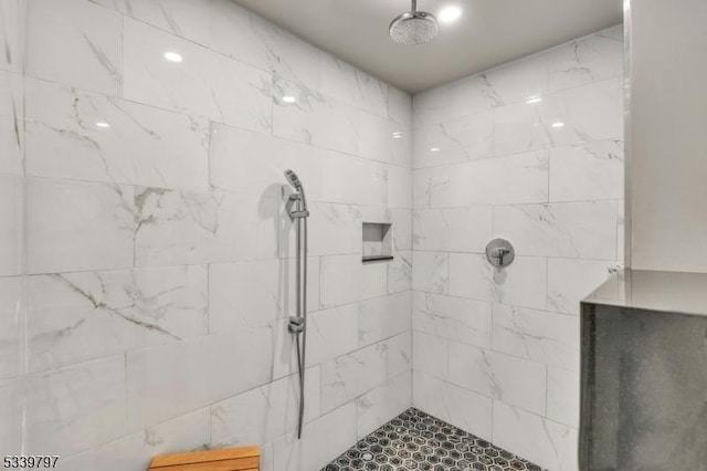 bathroom with tiled shower