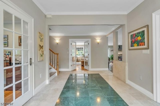 interior space featuring ornamental molding and baseboards