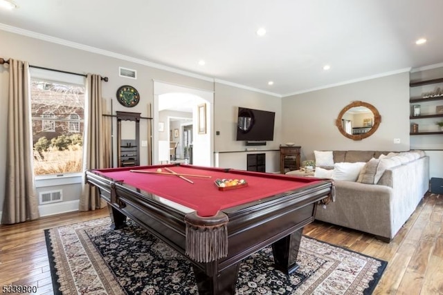 playroom with hardwood / wood-style floors, visible vents, and crown molding