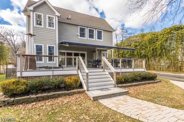 view of front facade featuring a wooden deck