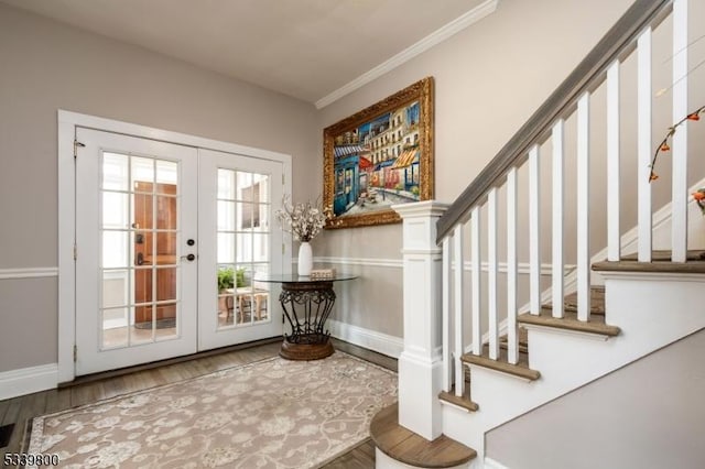 entryway with french doors, crown molding, stairway, wood finished floors, and baseboards