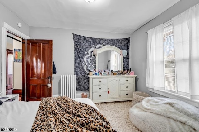 bedroom featuring radiator heating unit