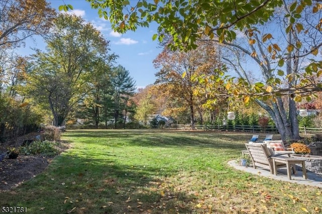 surrounding community with a patio, a lawn, and fence