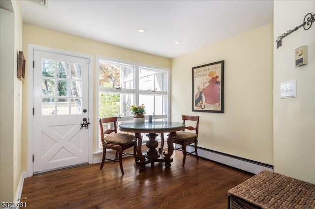 dining area with baseboard heating, dark wood-type flooring, and recessed lighting