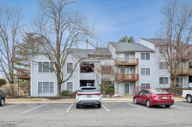 view of property featuring uncovered parking