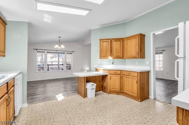 kitchen with lofted ceiling, white appliances, and light countertops