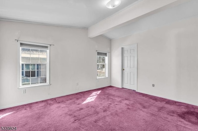 unfurnished room featuring carpet, lofted ceiling with beams, and baseboards