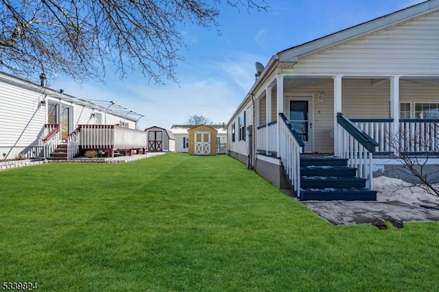 view of yard with a storage shed, covered porch, and an outdoor structure