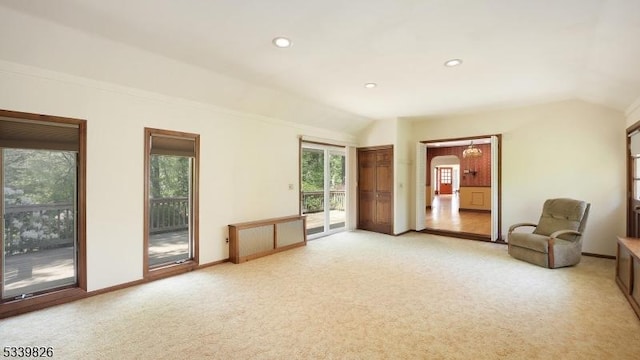 unfurnished room with recessed lighting, baseboards, vaulted ceiling, and light carpet