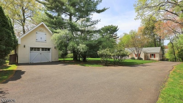 garage with a garage and driveway