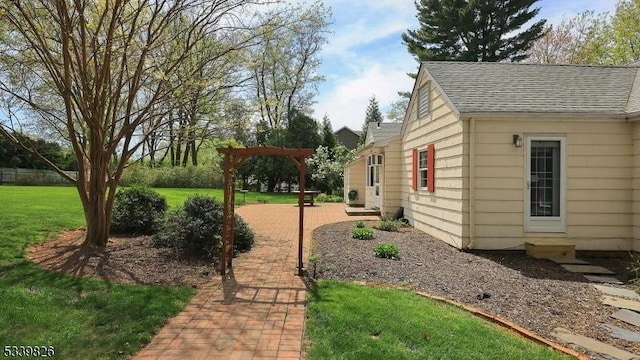 view of yard with a patio and a pergola