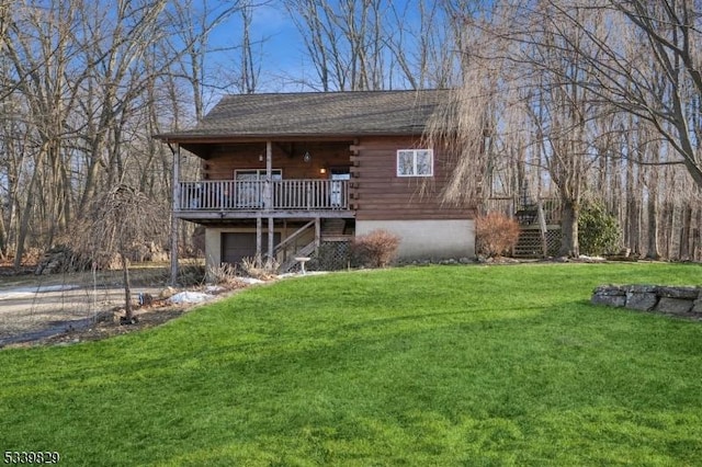 view of front facade featuring a garage, driveway, a front yard, and log siding