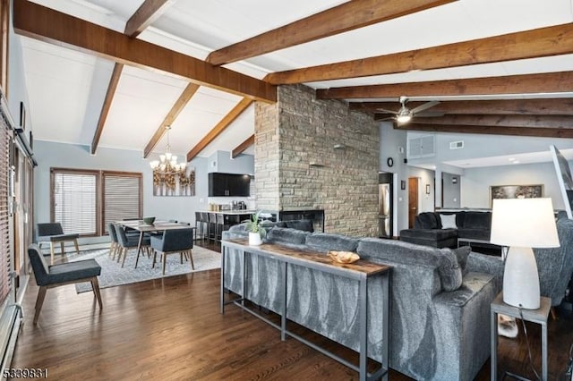 living area featuring a baseboard radiator, dark wood-style flooring, a stone fireplace, beam ceiling, and ceiling fan with notable chandelier