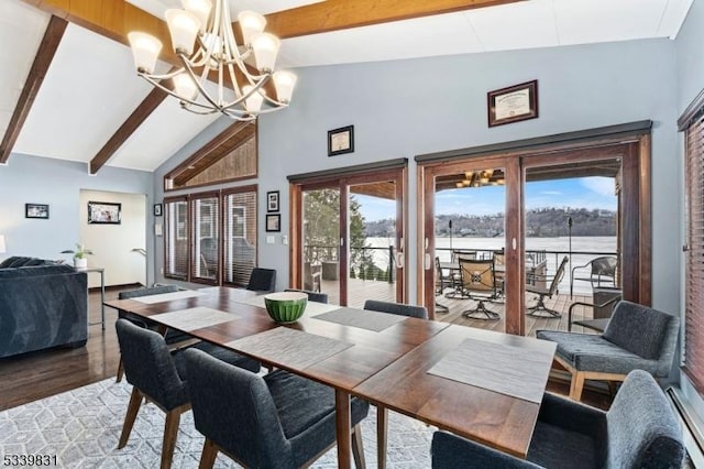 dining space with high vaulted ceiling, beamed ceiling, light wood-style flooring, and a notable chandelier