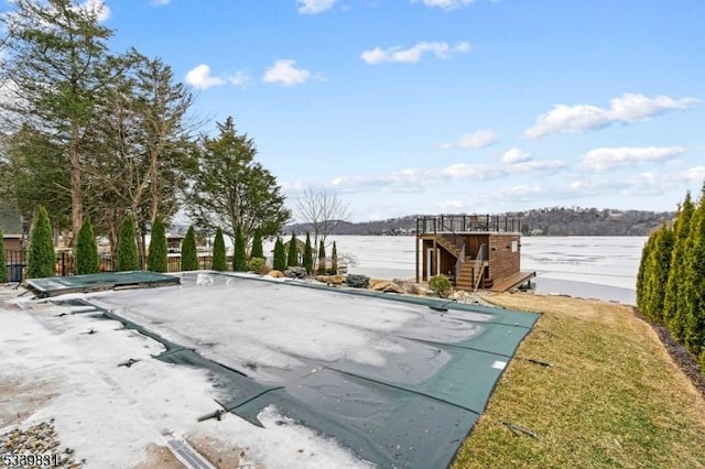 view of swimming pool with a water view