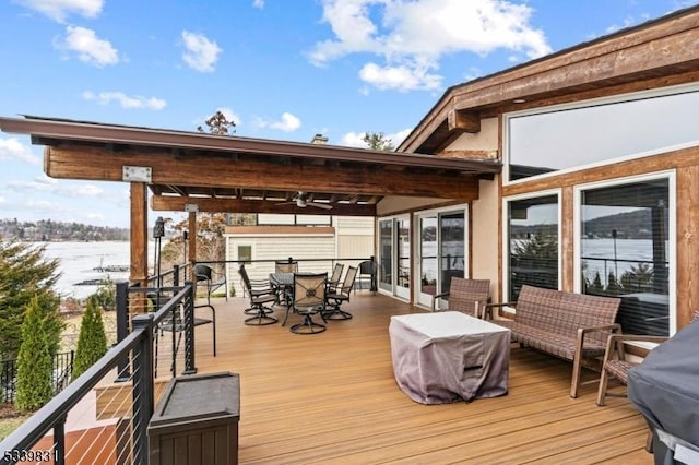 wooden terrace featuring outdoor dining space