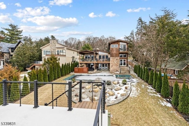 view of property's community with fence and a wooden deck