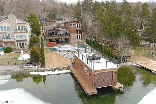 dock area featuring a water view and fence