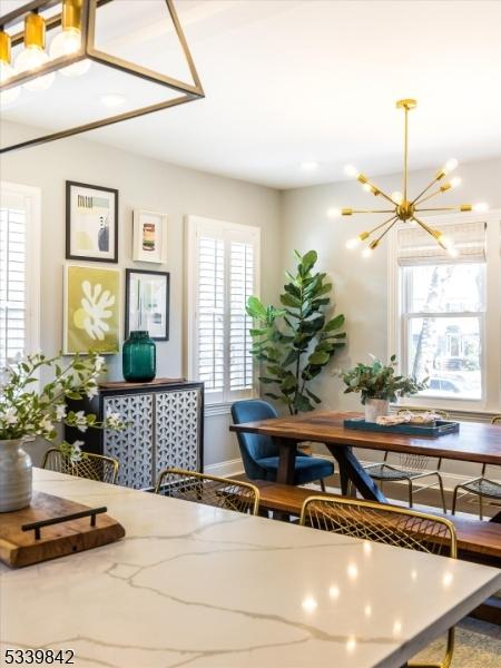 dining space featuring a notable chandelier