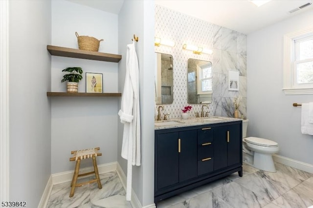 full bathroom with visible vents, marble finish floor, toilet, and a sink