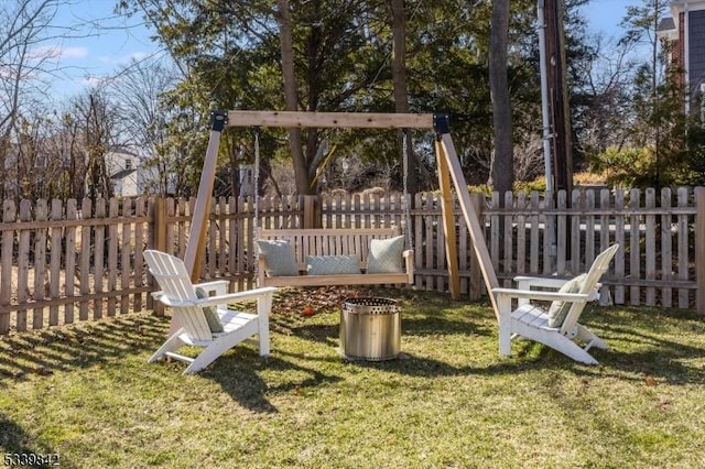 view of play area featuring a yard and fence