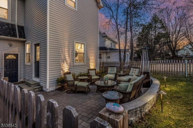 view of patio featuring an outdoor living space and fence