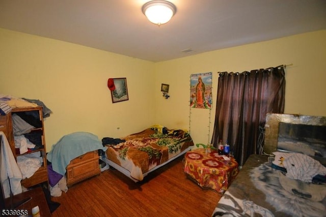 bedroom with wood finished floors