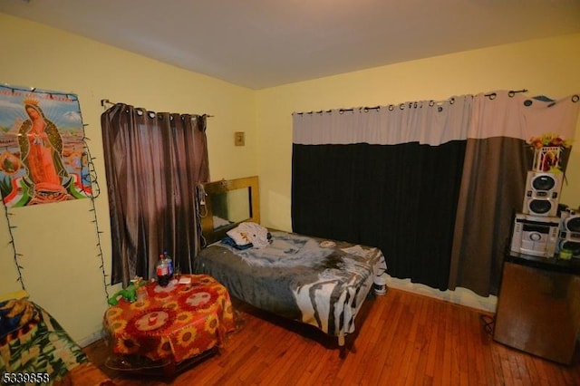 bedroom featuring wood finished floors