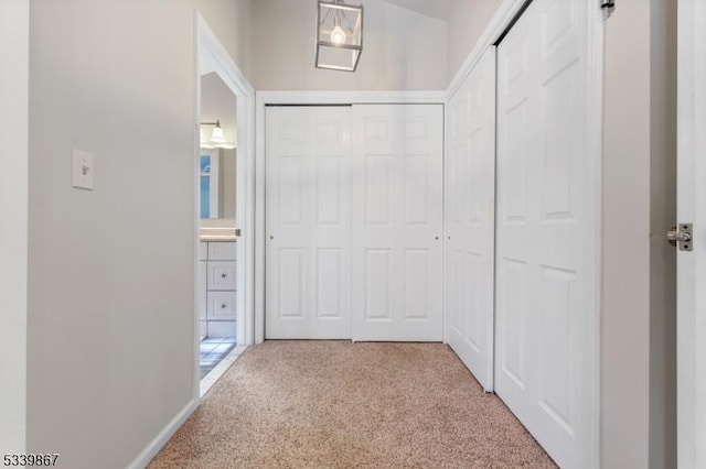 hallway with light carpet