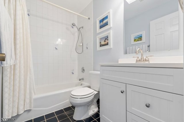 full bath featuring toilet, tile patterned flooring, shower / bath combo, and vanity