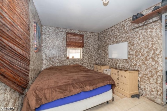 bedroom featuring light tile patterned floors