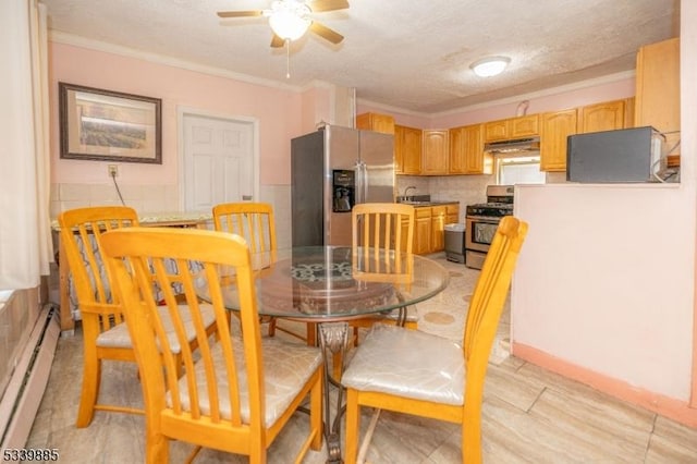 dining space with a baseboard heating unit, crown molding, a textured ceiling, and a ceiling fan