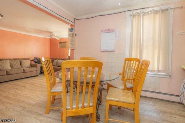 dining room with crown molding and ceiling fan