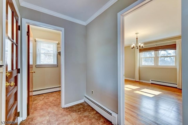 corridor with ornamental molding, a healthy amount of sunlight, and baseboard heating