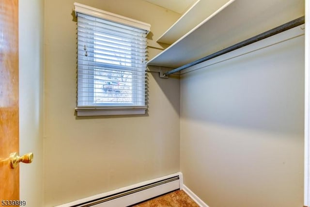 walk in closet featuring a baseboard radiator