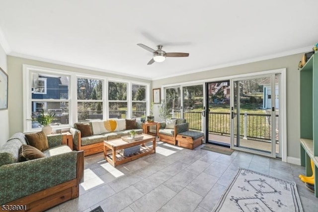 sunroom / solarium with a ceiling fan