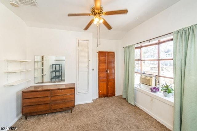 bedroom with baseboards, visible vents, vaulted ceiling, cooling unit, and carpet flooring