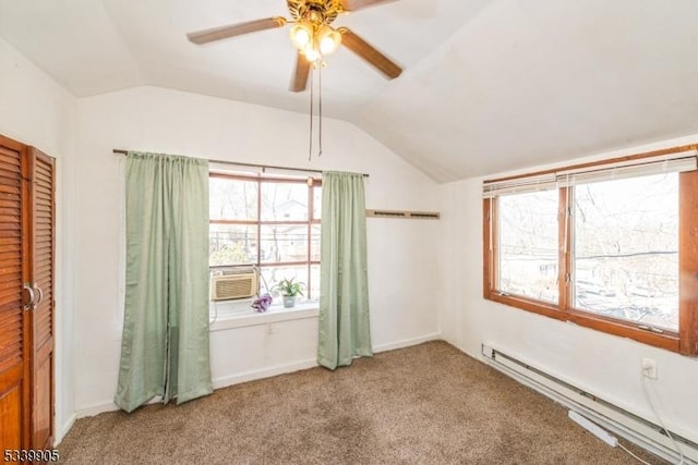 spare room featuring a ceiling fan, a baseboard radiator, vaulted ceiling, cooling unit, and carpet floors